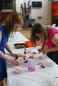 Aine and Sarah make cupcakes pretty with pink!