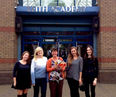 Rebecca, Donna, Danielle, and Paula with Leith Academy school librarian Christine Boal, who is featuring some of the donated books