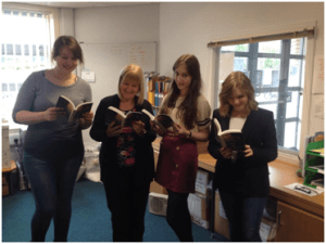 Handing over copies of Peter and Wendy at the school reception