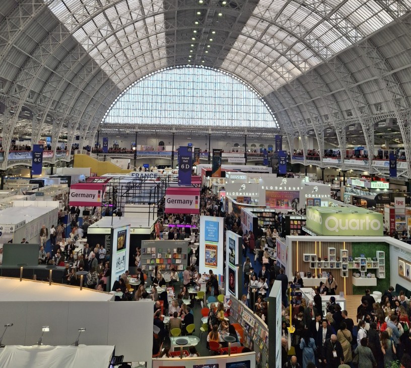 Venue shows many publishing stalls and is full of people.